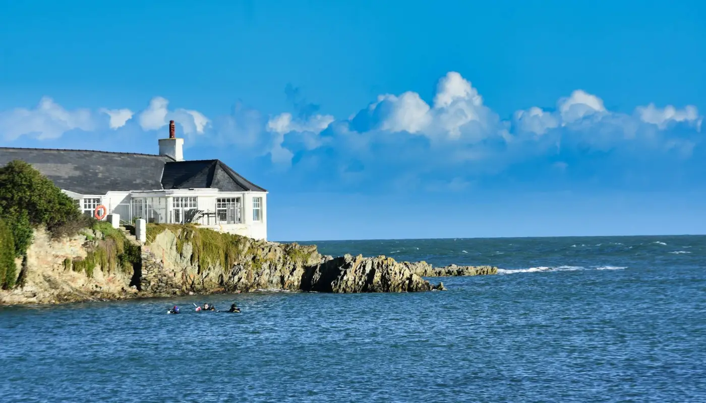 House on a cliff next to the ocean