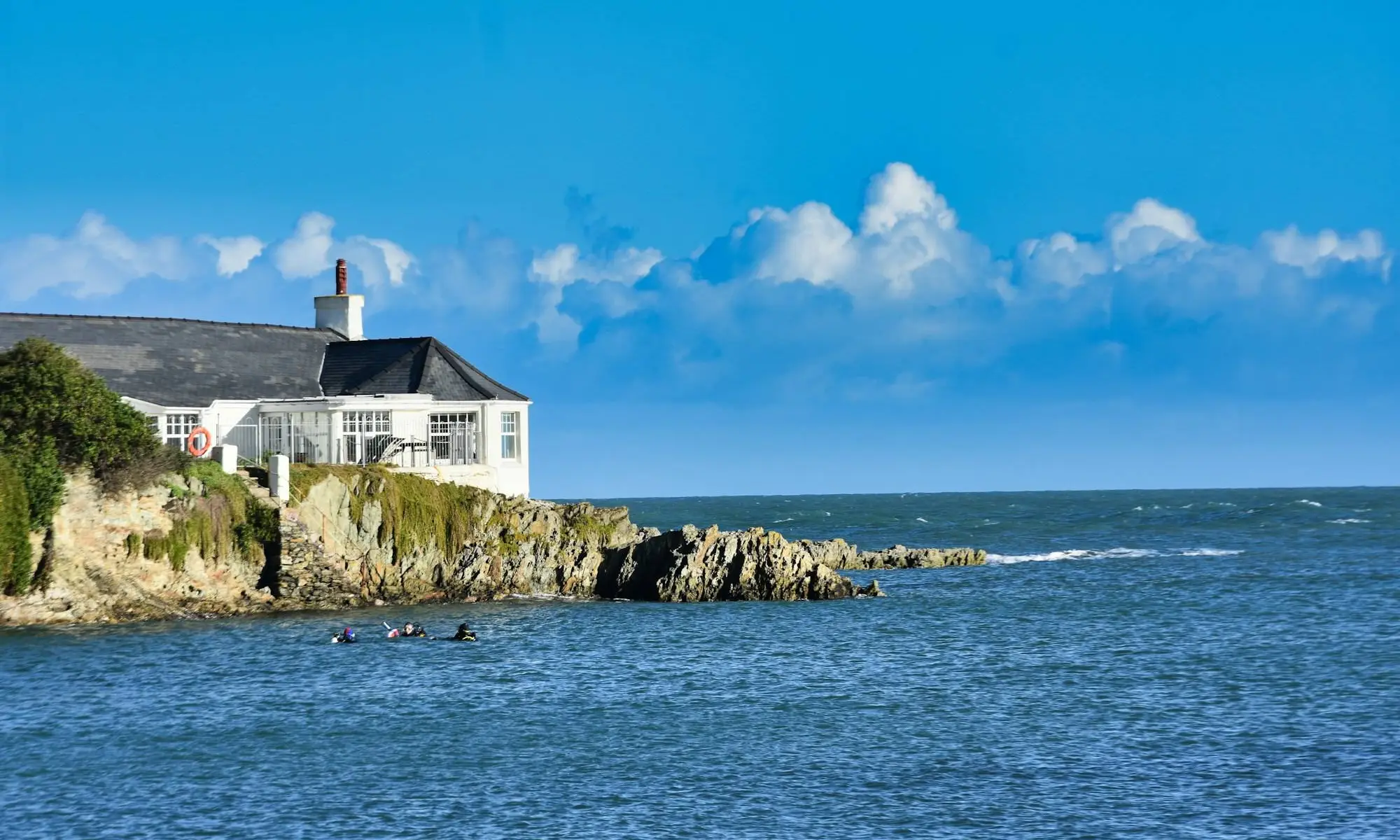 House on a cliff next to the ocean