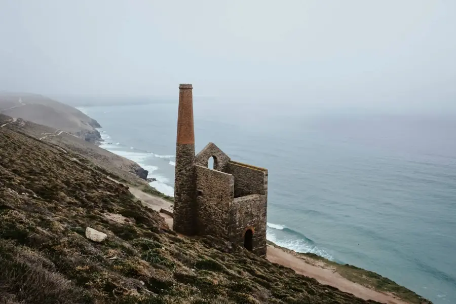 Stone building on a cliff by the ocean
