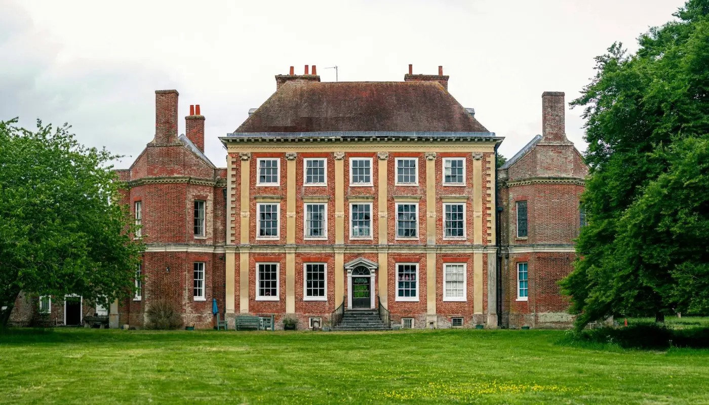 Grand manor house with green lawns