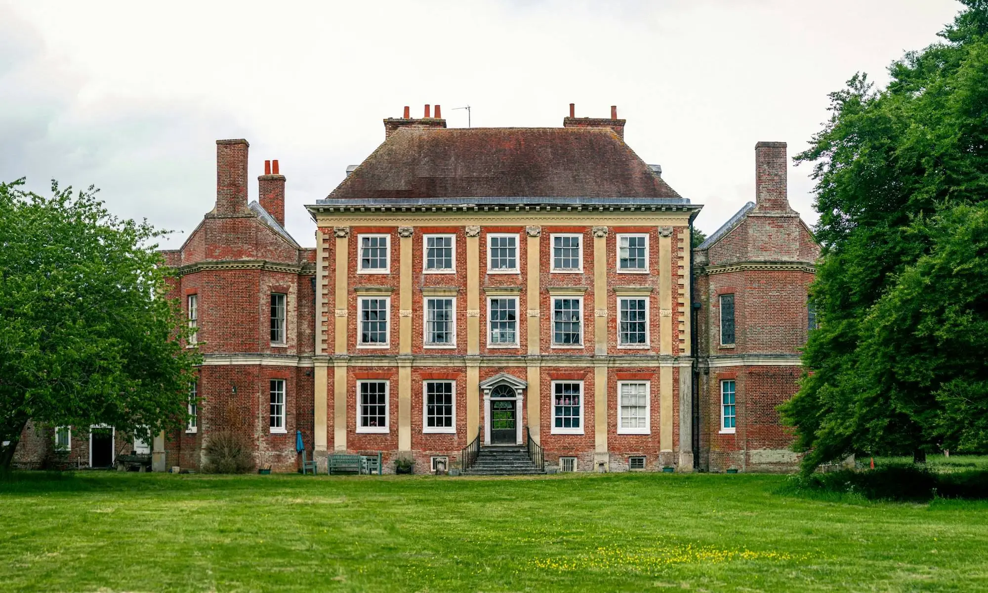 Grand manor house with green lawns