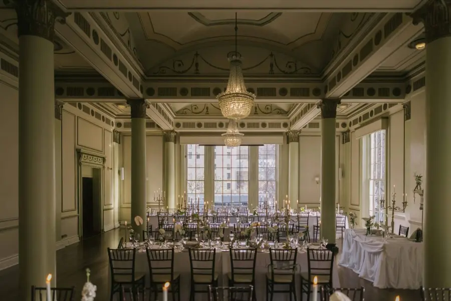 Ballroom with long tables and chandeliers