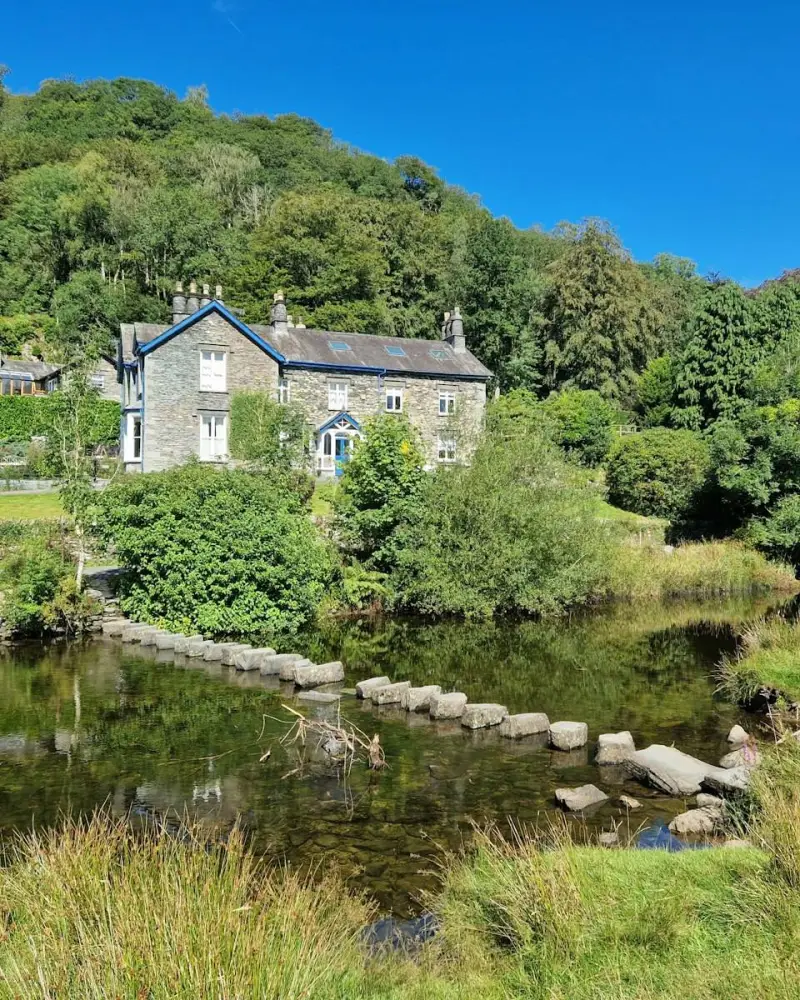 A house on a hill by a river