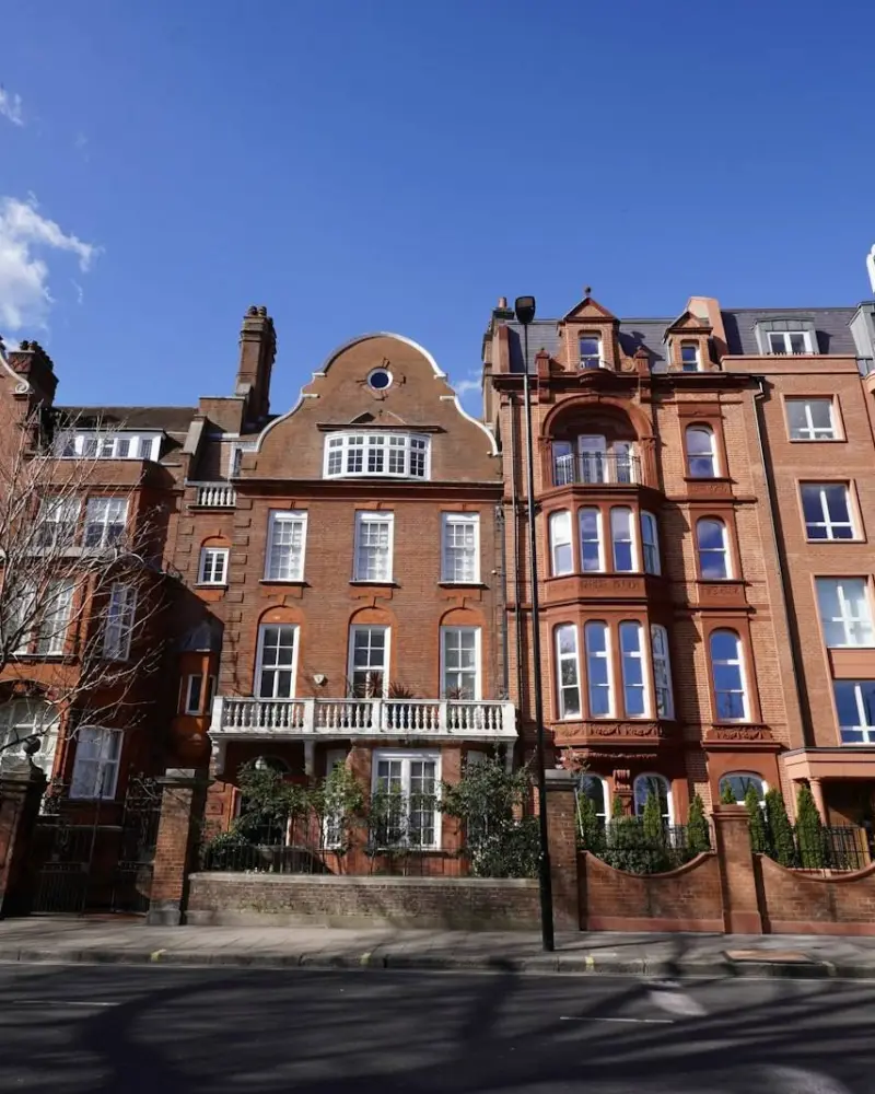 A row of red brick buildings on a city street