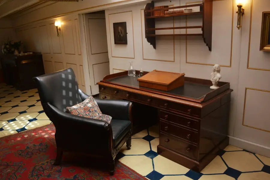 Wooden desk and leather armchair