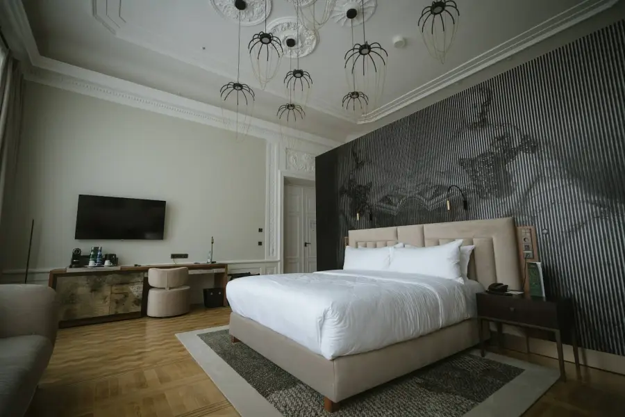 Hotel bedroom with patterned wall