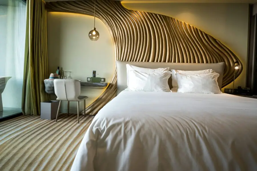 Bedroom with a wooden headboard
