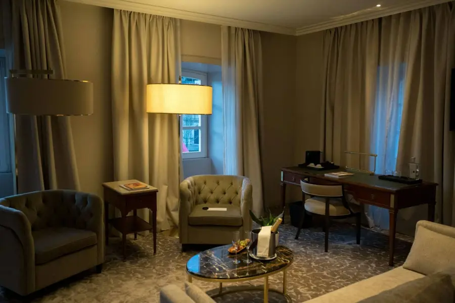 Hotel room with seating and a desk
